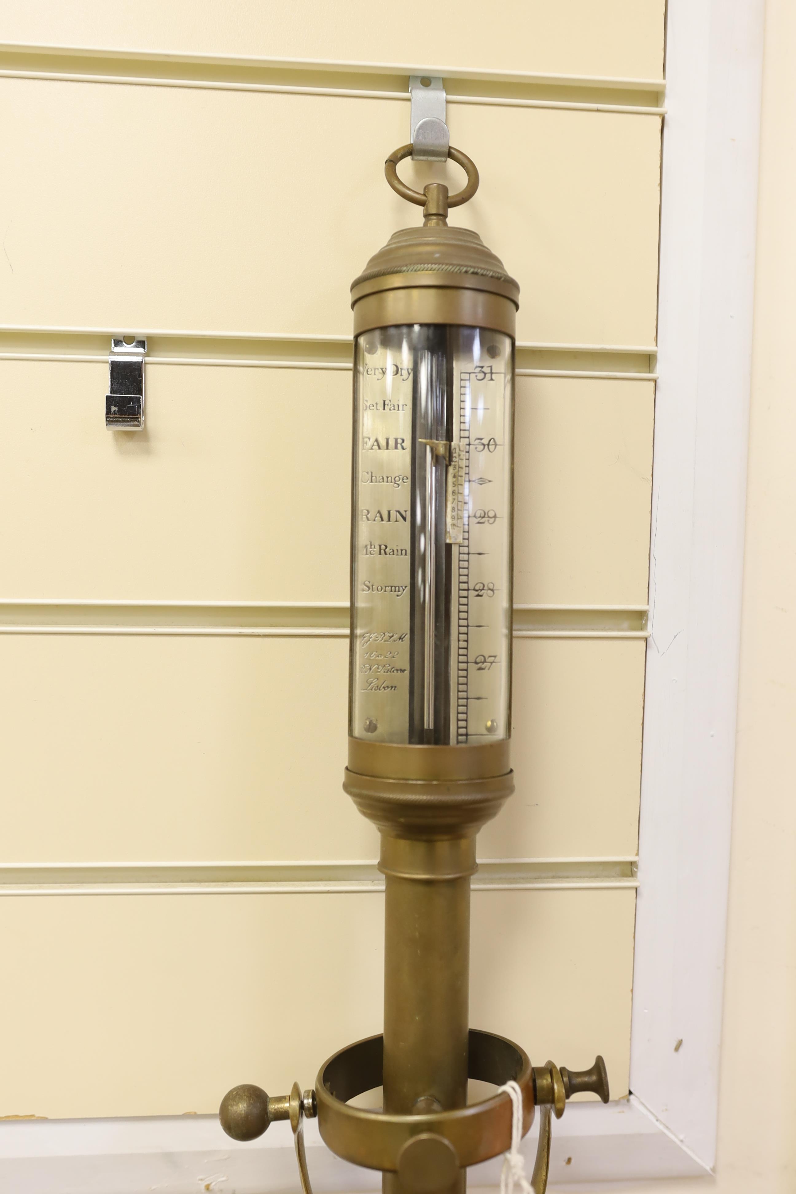 An early twentieth century marine barometer with a brass body mounted on a gimbal by R.N. Desterre, Lisbon, 93cm